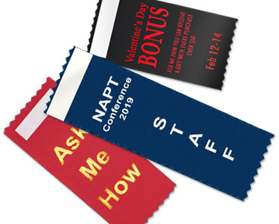 Text only badge ribbons with a vertical orientation and tape on the front.