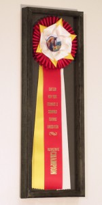 wheaton rosette ribbons in a frame for display