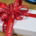 red thank you ribbon for administrative professionals day and other holidays