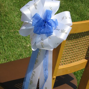 ribbon rolls used in decorating chairs at a wedding