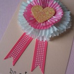 ribbon rolls and cupcake liners used to make rosette ribbons for valentine's day