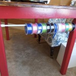 ribbon storage using a tension rod