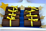 personalized ribbon rolls around swiss roll cakes