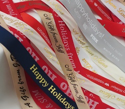 use custom ribbon rolls personalized with names, dates or festive messages for your holiday party