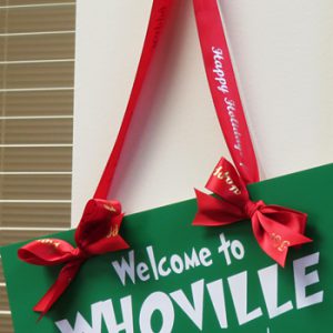 using personalized ribbons and custom signs for holiday decorations for home and office