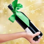 tie personalized ribbons to a bottle for easy wrapping with holiday bows for corporate gifting