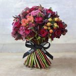 using single face satin ribbon to tie flower bouquets for a fall wedding