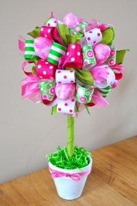 holiday easter ribbons in pinks, greens and whites to make a festive topiary with ribbon and flowers