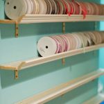 store your ribbon collection using decorative molding shelves