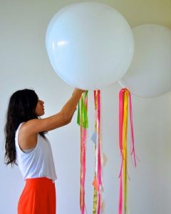 use fun bright ribbon rolls to accent balloons you are decorating with