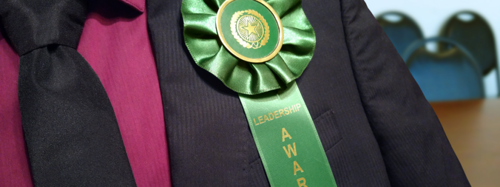 giving custom rosette ribbons as employee awards helps with company unity