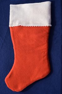 A felt Christmas stocking used to make ribbon stockings.