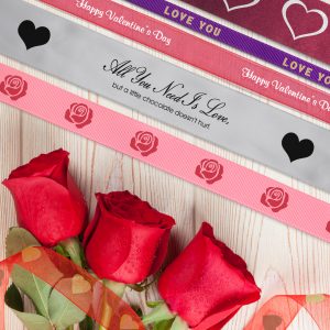 Add icons and graphics to ribbon rolls for Valentine's Day ribbons for any business.