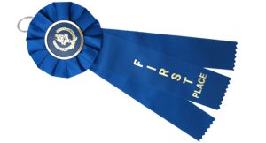 Stock award blue rosette ribbon with victory torch for first place.