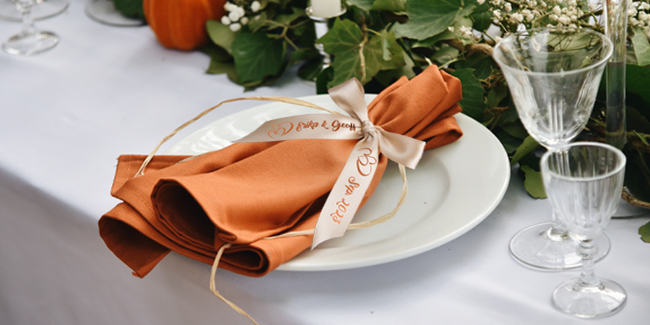 Silverware is tied together with a custom ribbon roll.